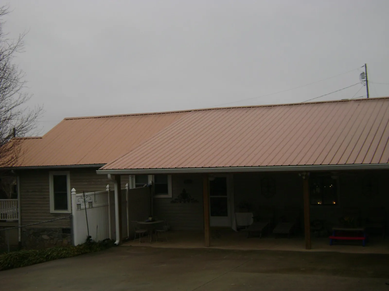 Copper toned metal roof over a wide covered patio in Queenstown